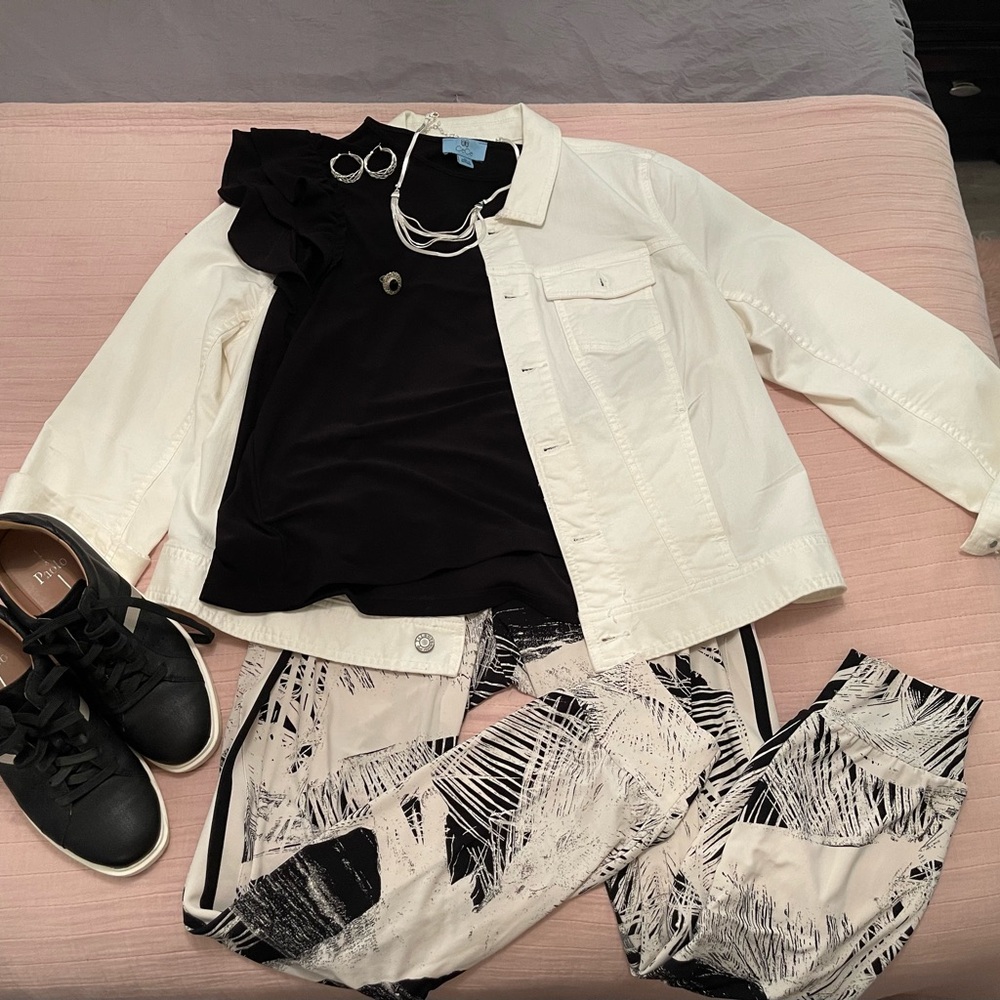 White Jacket with Black Top and Patterned Pants